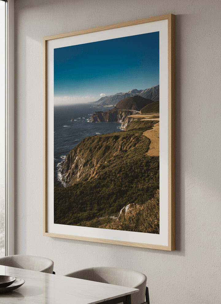 Wall art styled above a dining table in a contemporary home