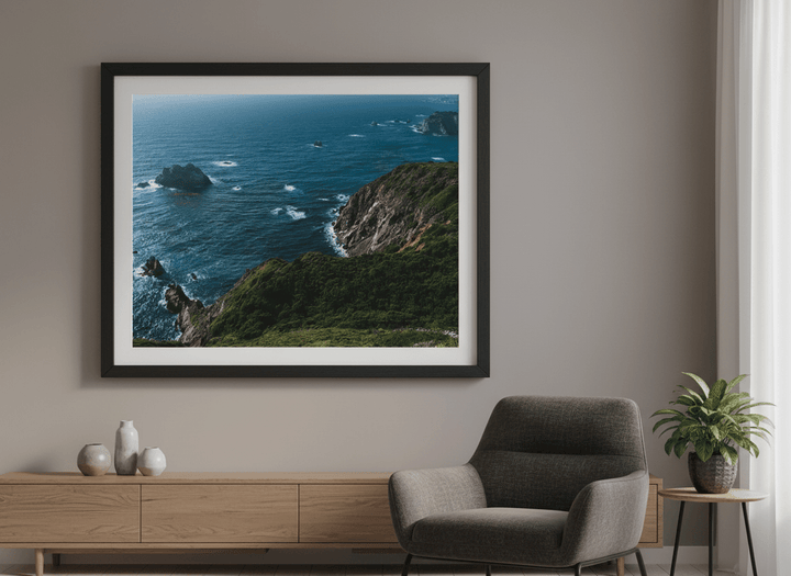Modern wall art styled above a sofa in a neutral living room