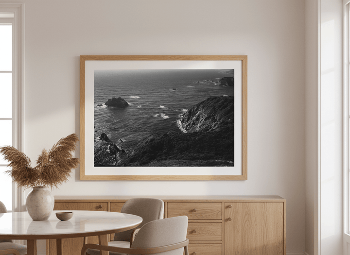 Wall art styled above a dining table in a contemporary home