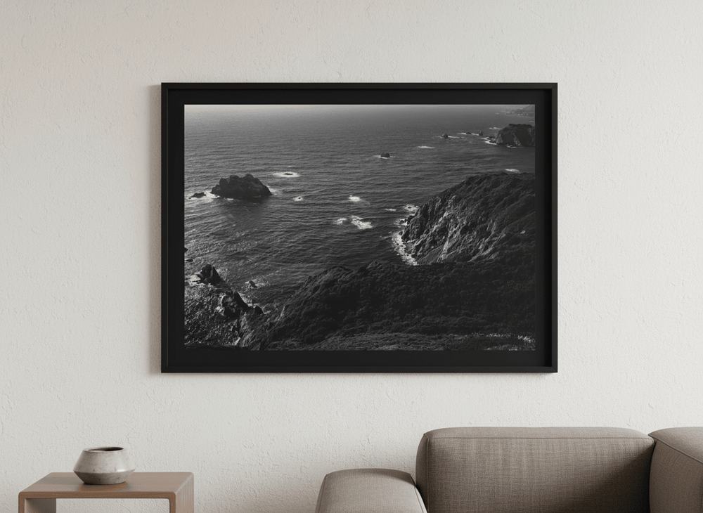 Modern wall art styled above a sofa in a neutral living room