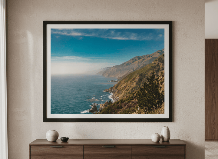 Wall art styled above a dining table in a contemporary home