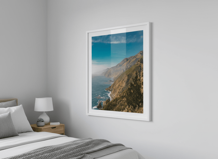 Minimalist artwork displayed in a calm, light-filled bedroom interior