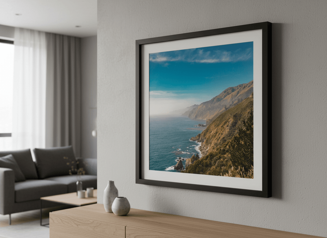 Modern wall art styled above a sofa in a neutral living room