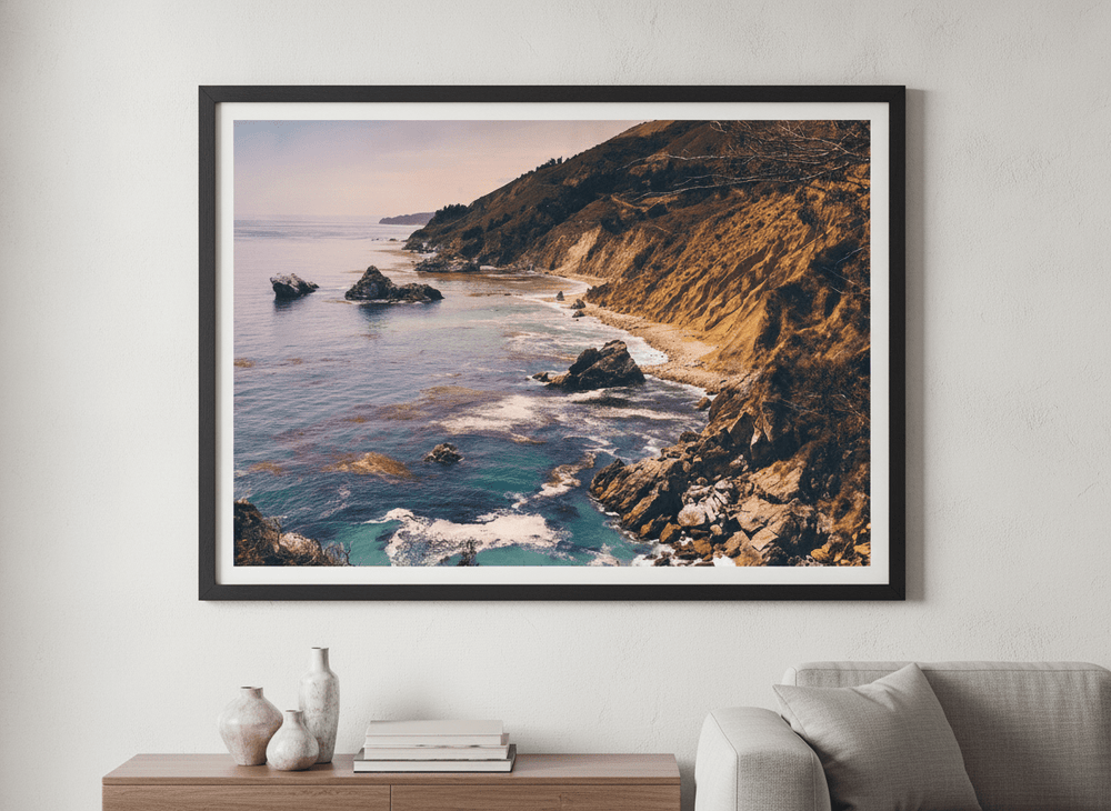 Modern wall art styled above a sofa in a neutral living room