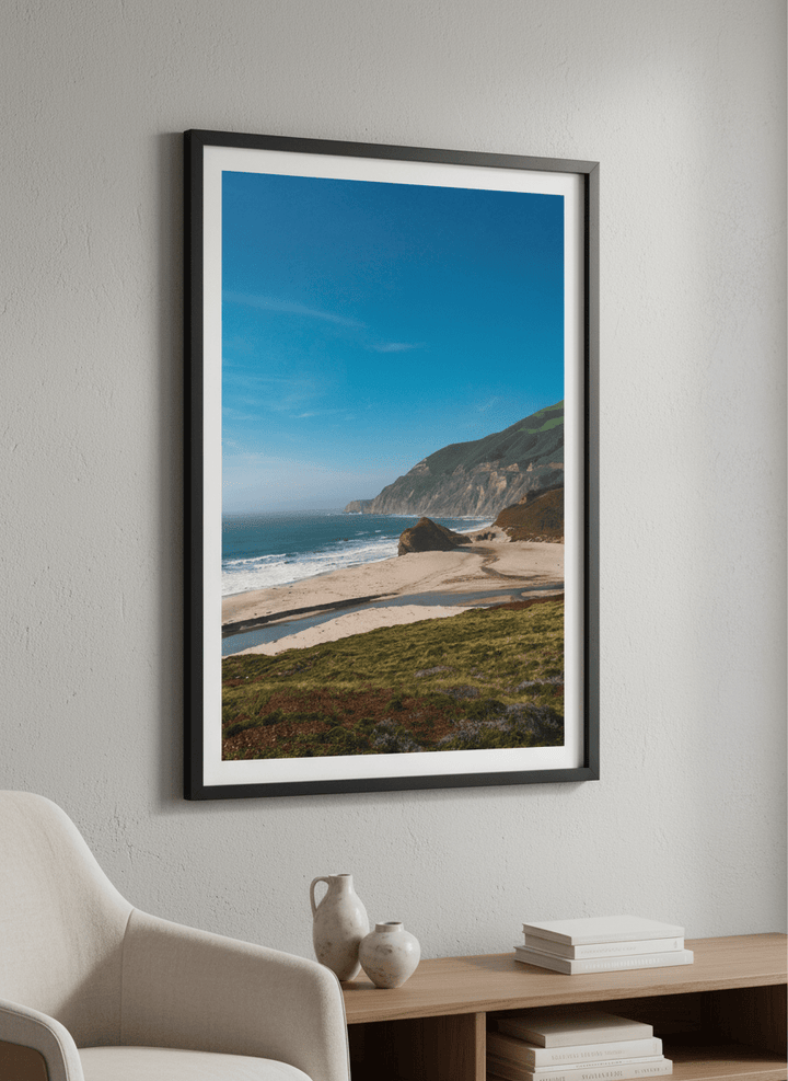 Modern wall art styled above a sofa in a neutral living room
