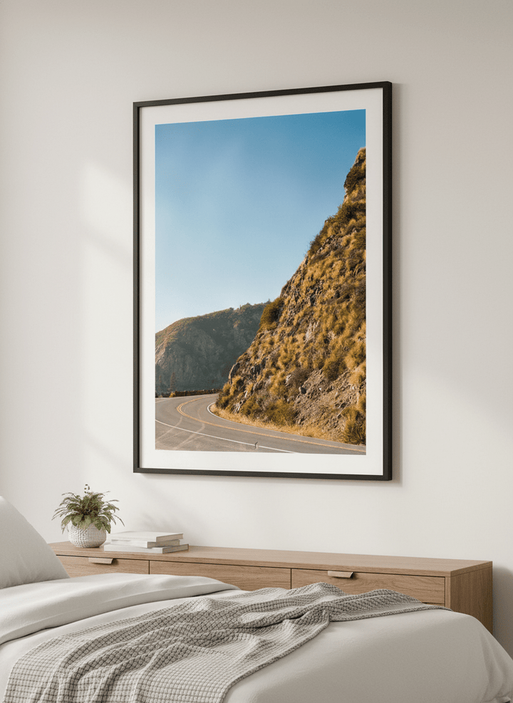 Minimalist artwork displayed in a calm, light-filled bedroom interior