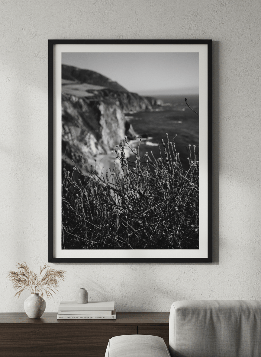 Modern wall art styled above a sofa in a neutral living room