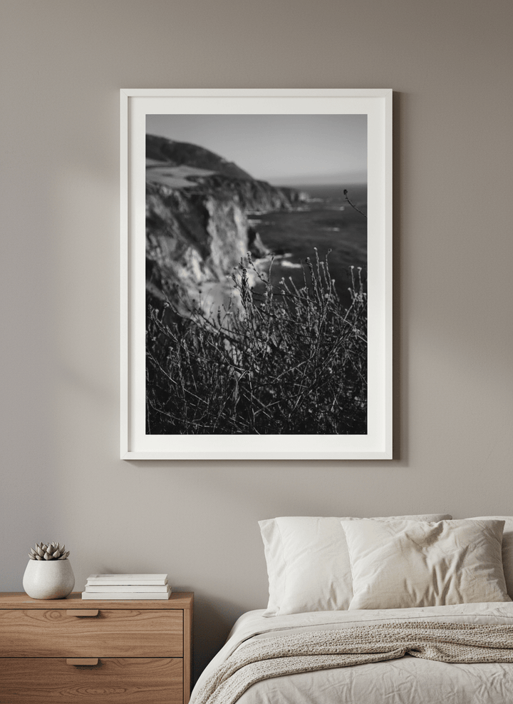 Minimalist artwork displayed in a calm, light-filled bedroom interior