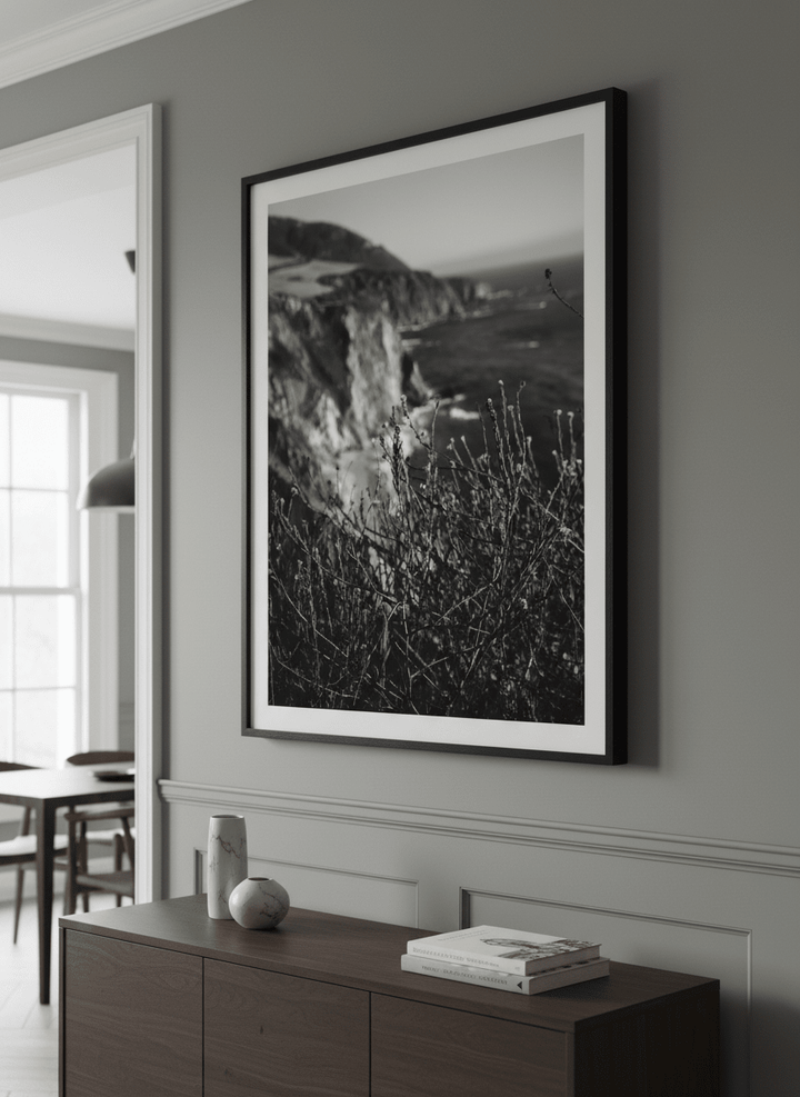Wall art styled above a dining table in a contemporary home