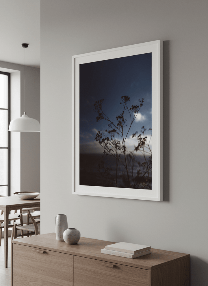 Wall art styled above a dining table in a contemporary home