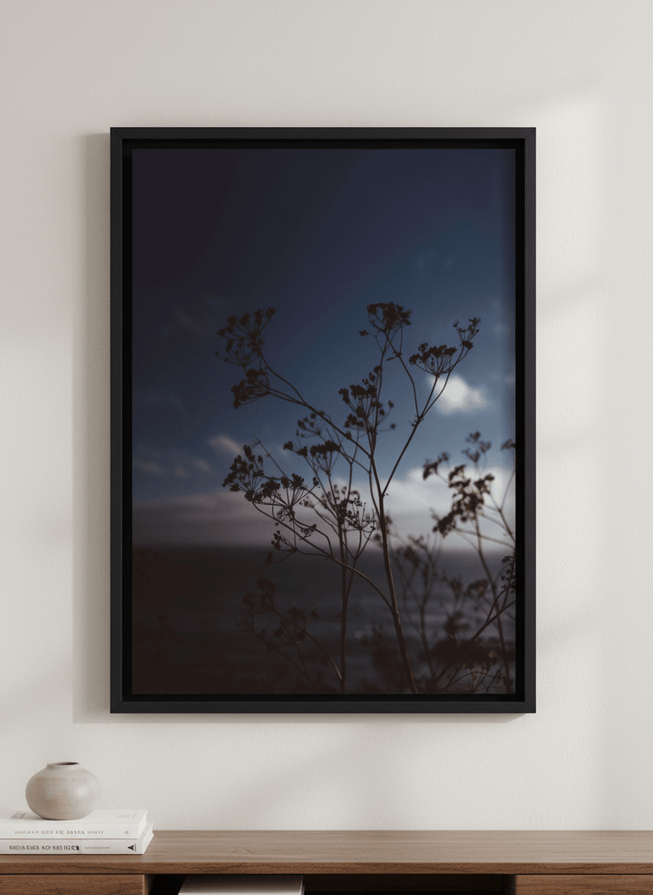 Modern wall art styled above a sofa in a neutral living room