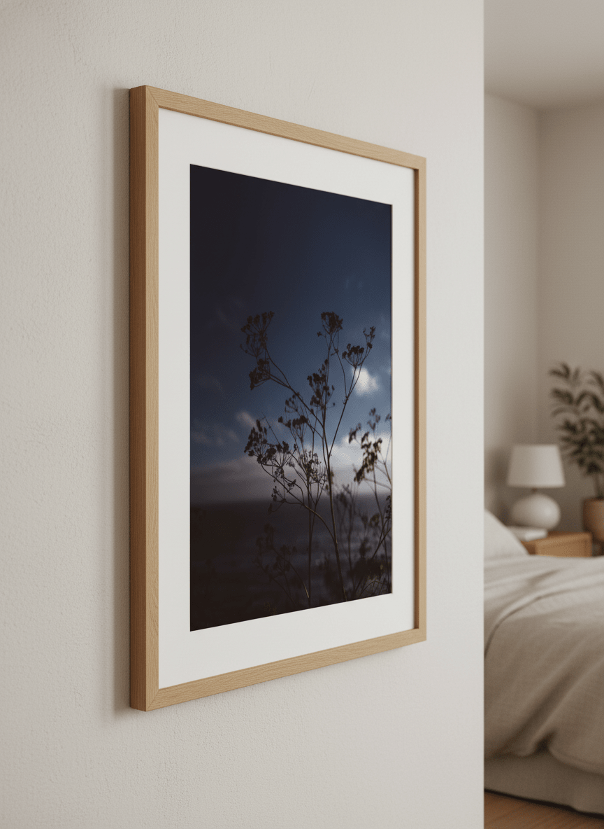 Minimalist artwork displayed in a calm, light-filled bedroom interior