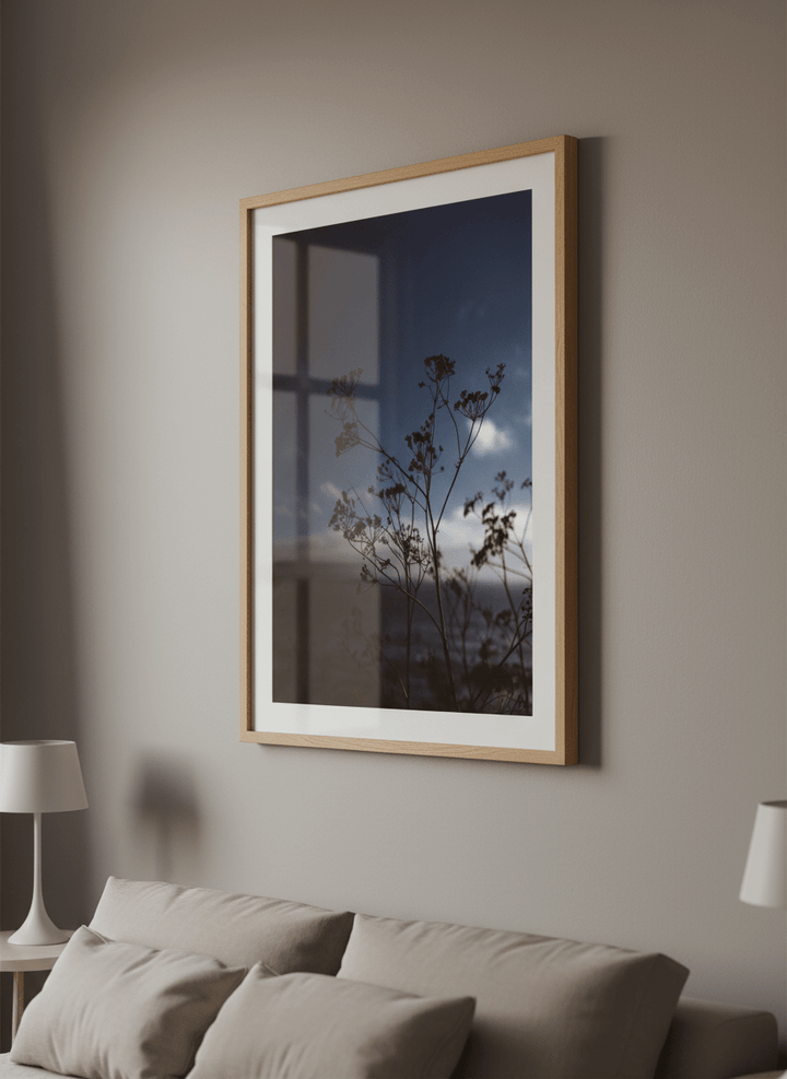 Minimalist artwork displayed in a calm, light-filled bedroom interior