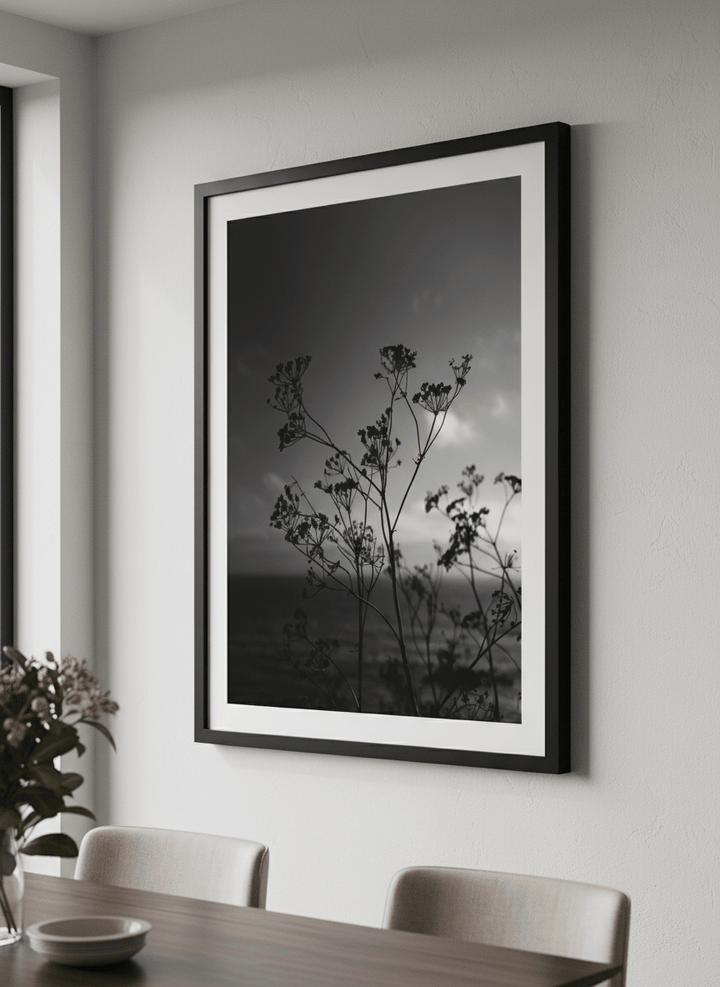 Wall art styled above a dining table in a contemporary home