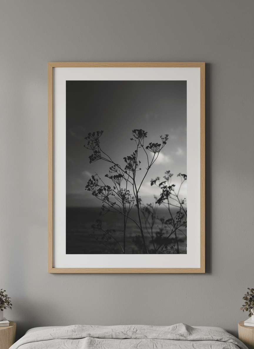 Minimalist artwork displayed in a calm, light-filled bedroom interior