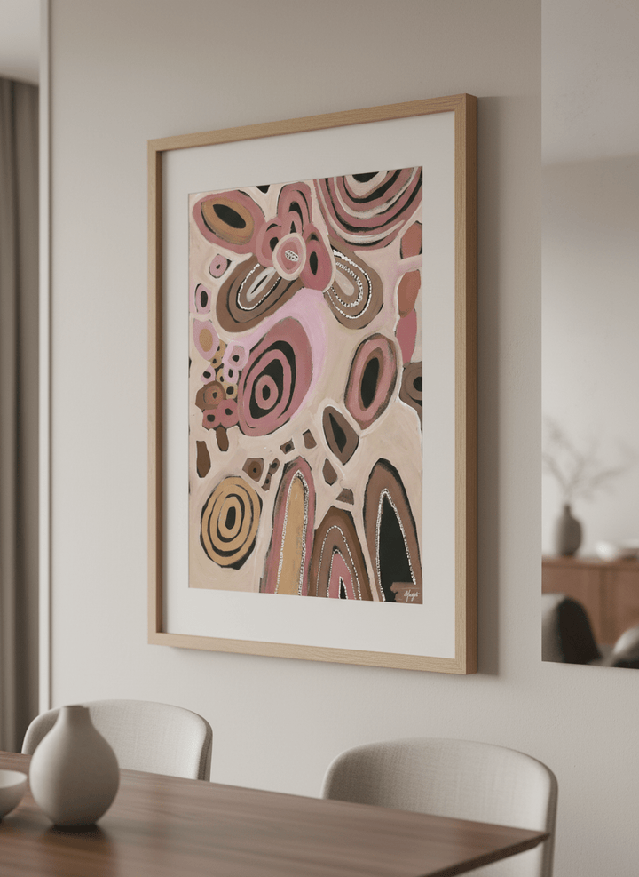 Wall art styled above a dining table in a contemporary home