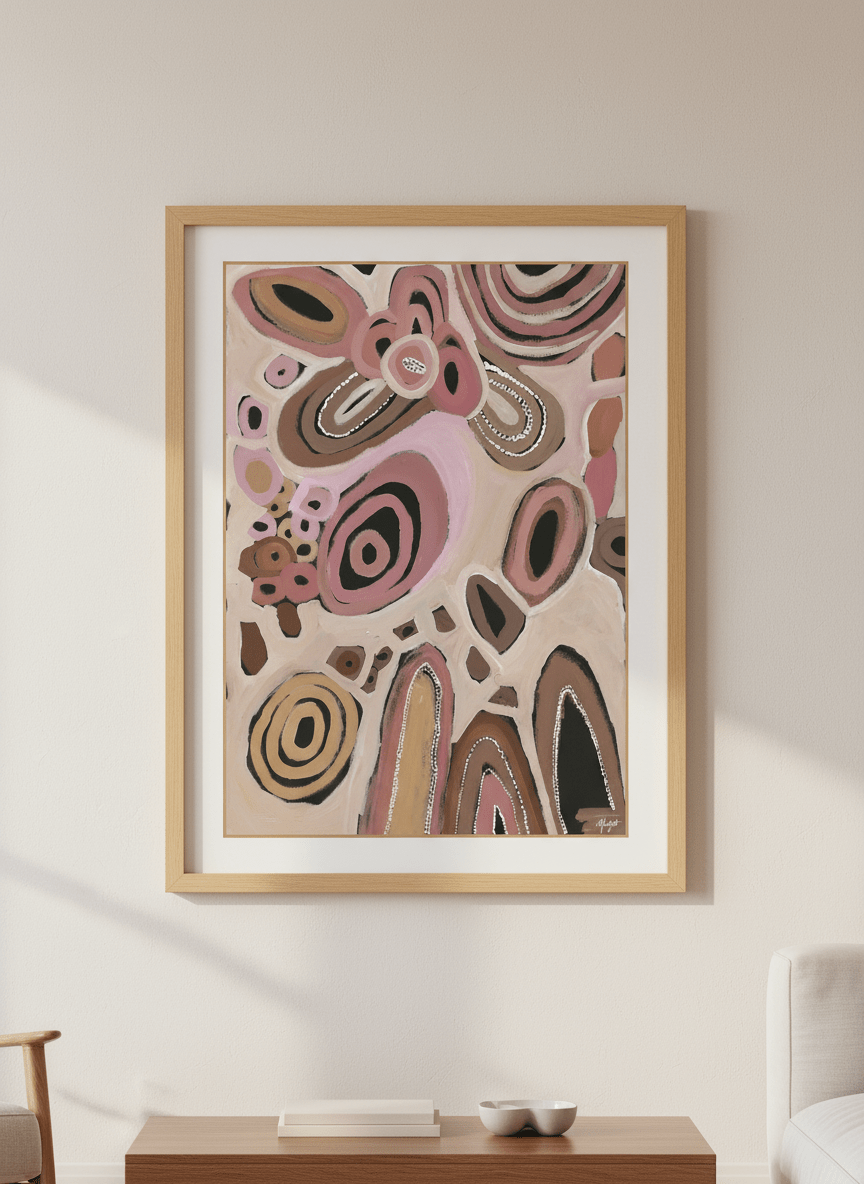 Modern wall art styled above a sofa in a neutral living room