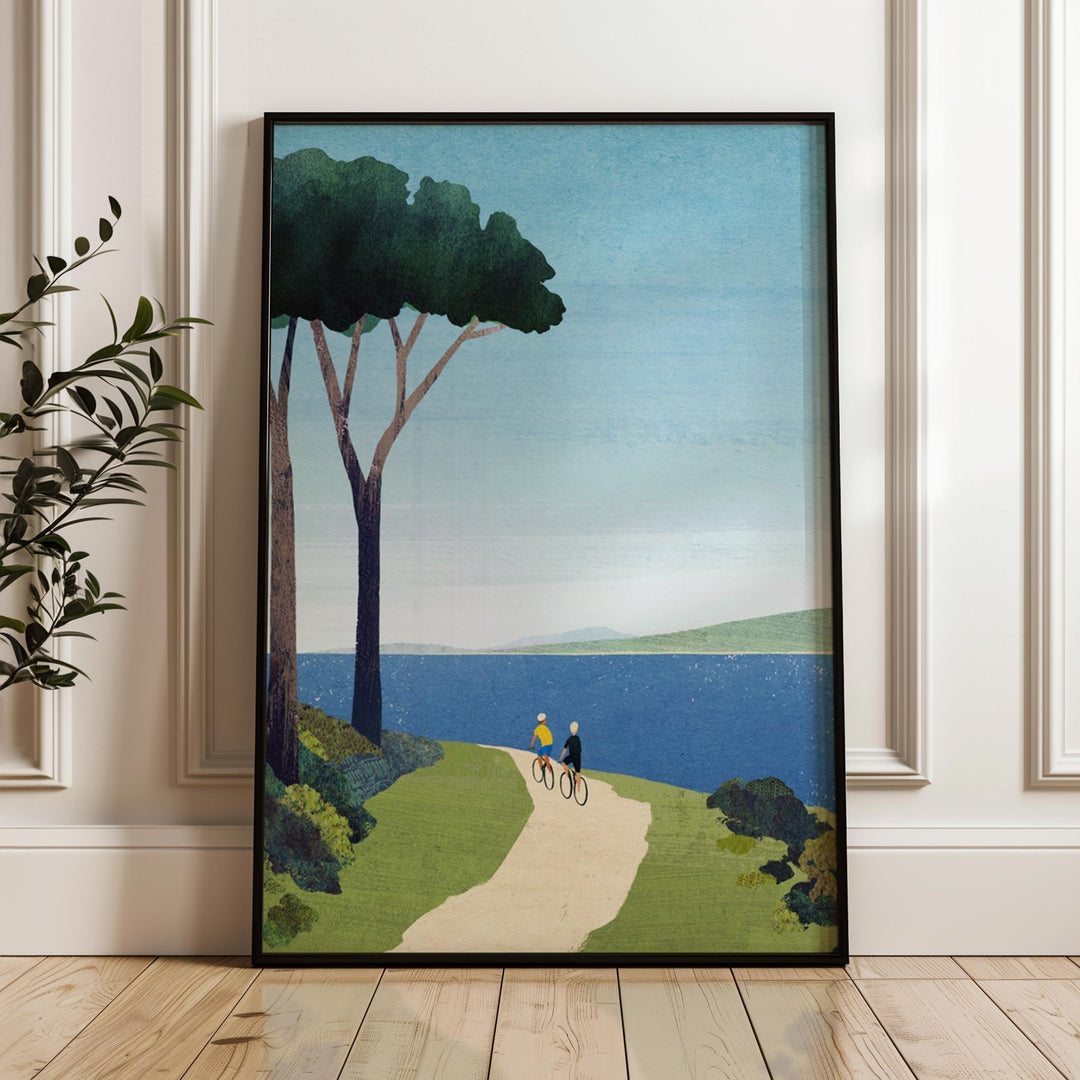 Artwork of a cyclist on a path by a lake with trees, displayed on a wall.