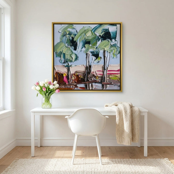 Canvas wall art with a gold leaf surround styled on the wall in a bright Scandinavian home office