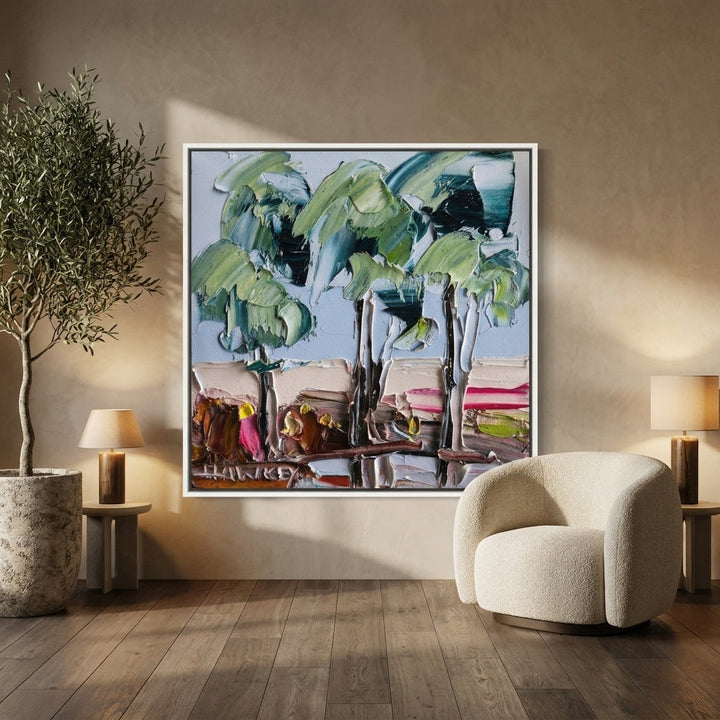 Canvas wall art with a white surround leaning against the wall in a luxe bedroom