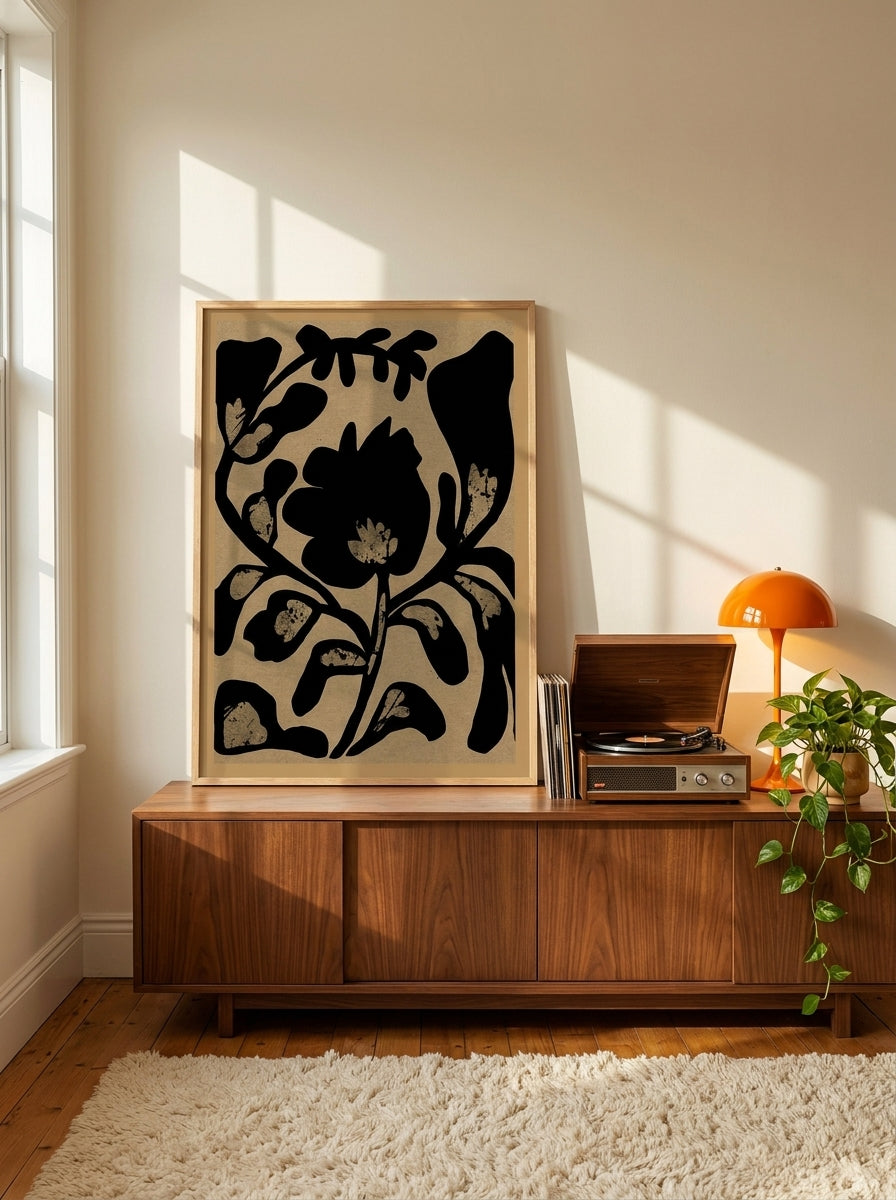 Modern wall art print standing on a sideboard in a retro 70s home office