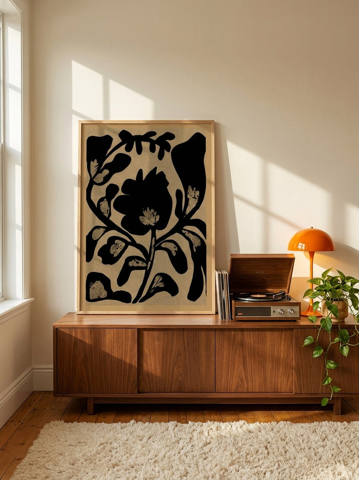Modern wall art print standing on a sideboard in a retro 70s home office