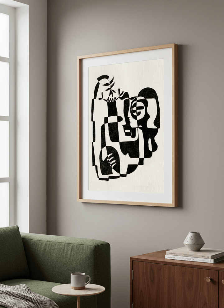 Modern wall art styled above a sofa in a neutral living room