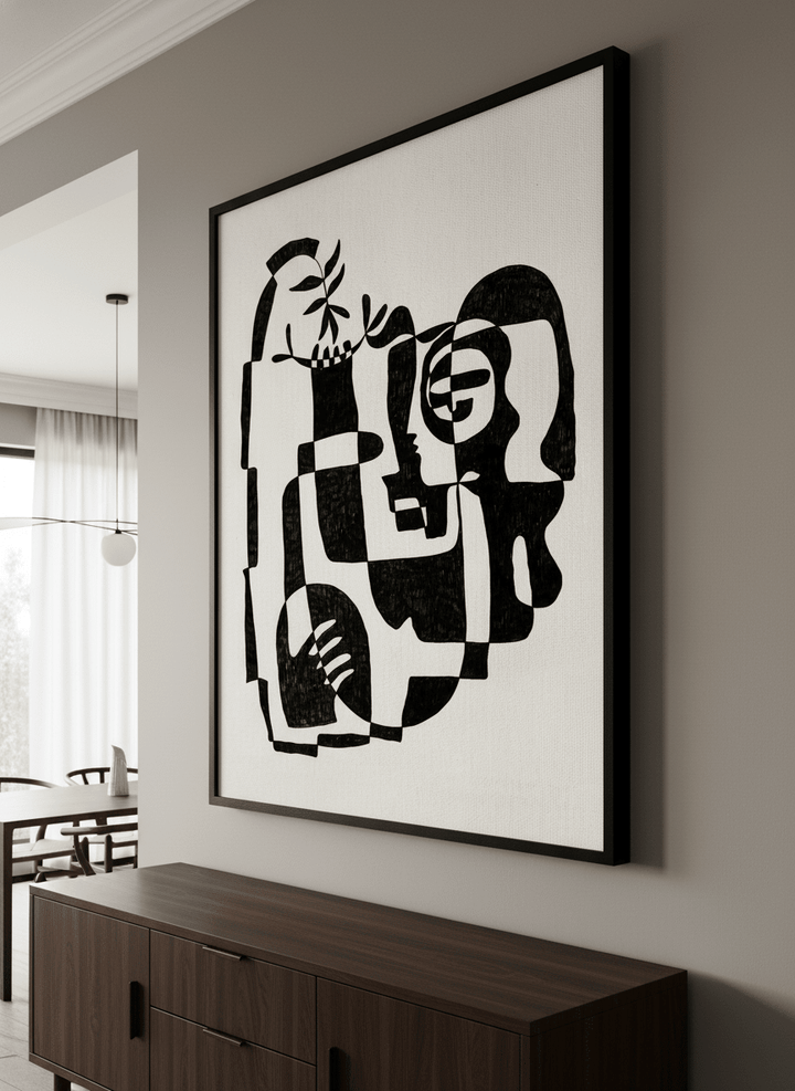 Wall art styled above a dining table in a contemporary home