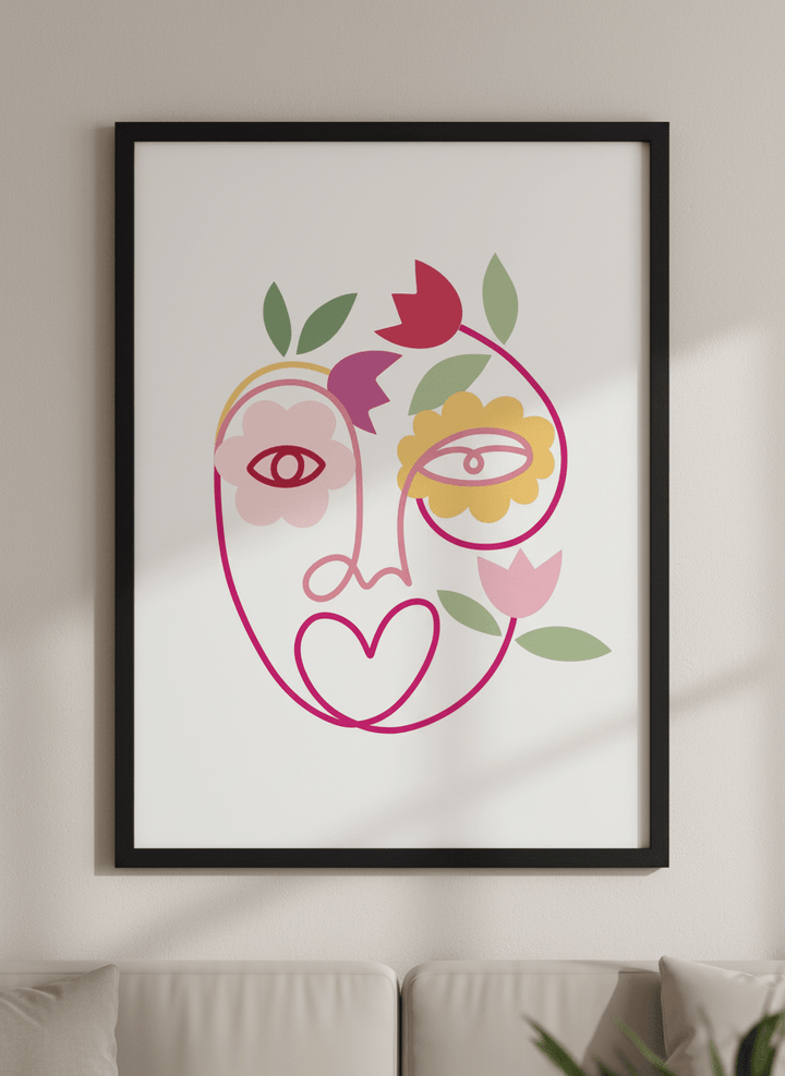 Modern wall art styled above a sofa in a neutral living room