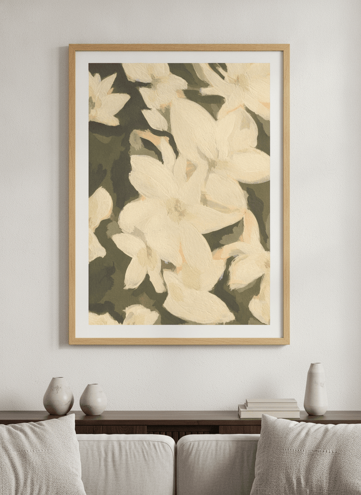 Modern wall art styled above a sofa in a neutral living room