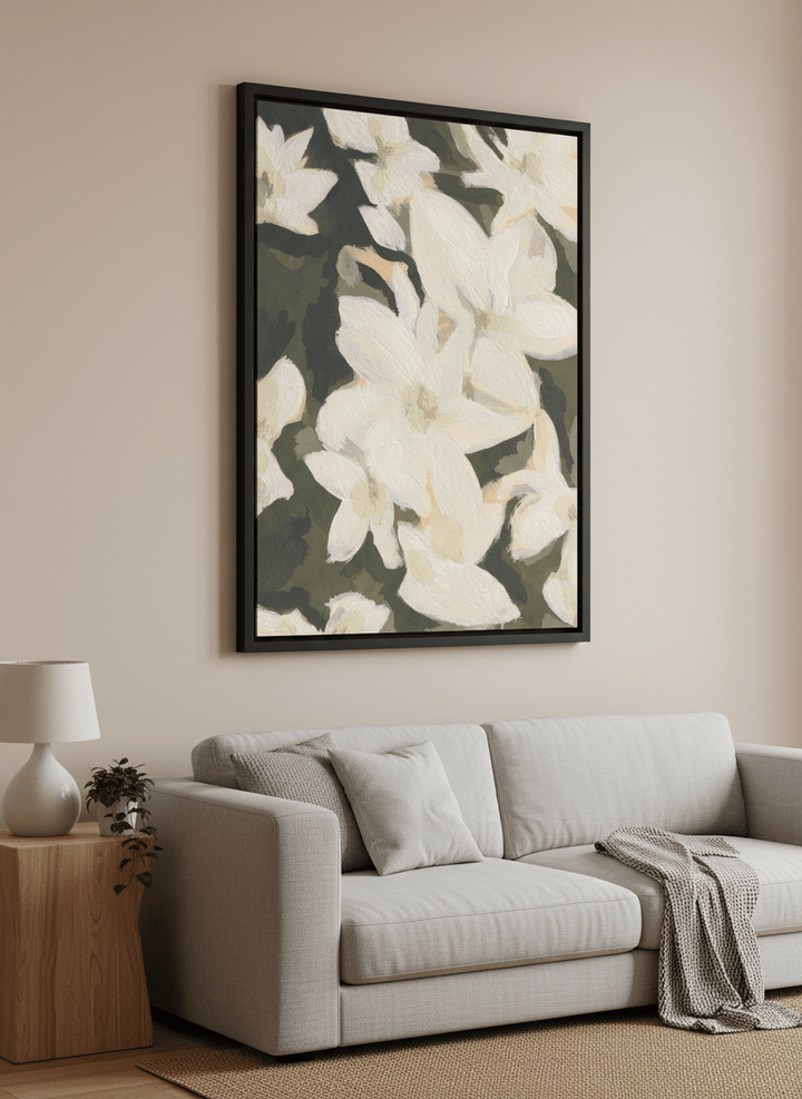 Modern wall art styled above a sofa in a neutral living room