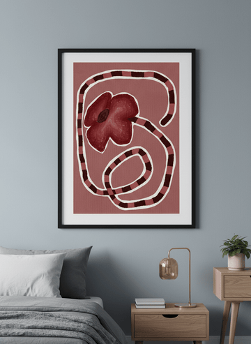 Minimalist artwork displayed in a calm, light-filled bedroom interior
