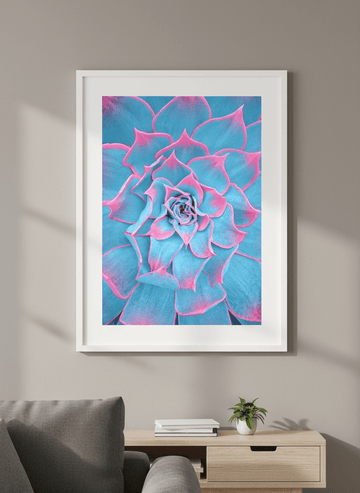 Modern wall art styled above a sofa in a neutral living room