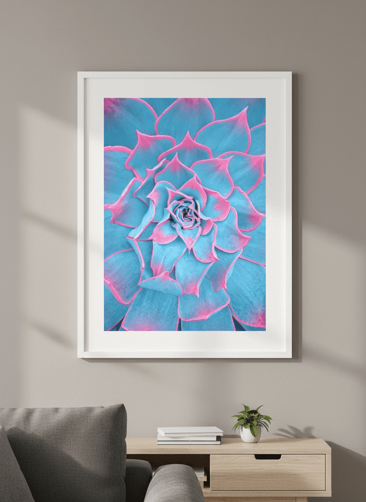 Modern wall art styled above a sofa in a neutral living room