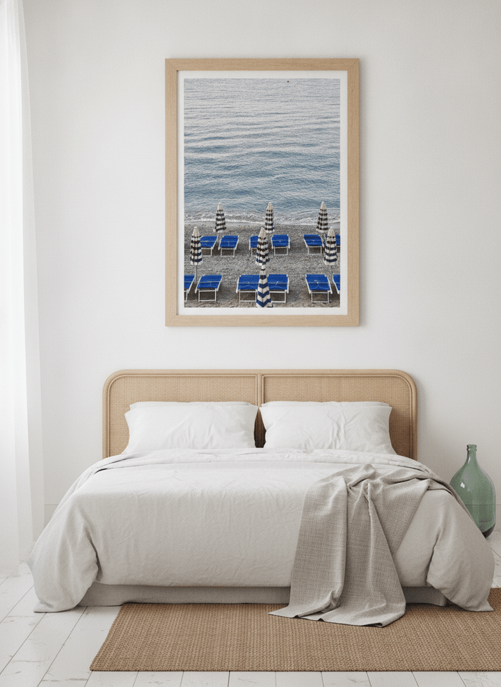 Modern wall art print styled on the wall in a coastal bedroom