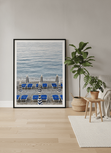 Oversized statement modern wall art print leaning against the wall in a bright Scandinavian living room
