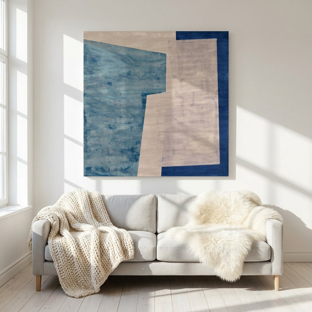 Stretched canvas wall art styled on the wall in a bright Scandinavian living room