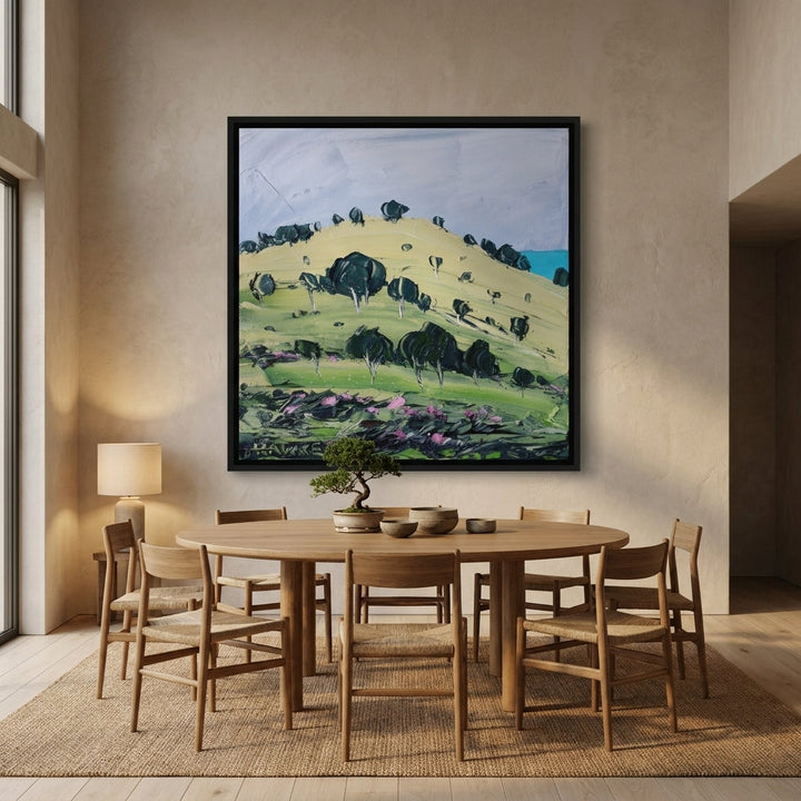 Oversized statement canvas wall art with a black surround styled on the wall in a warm Japandi dining room