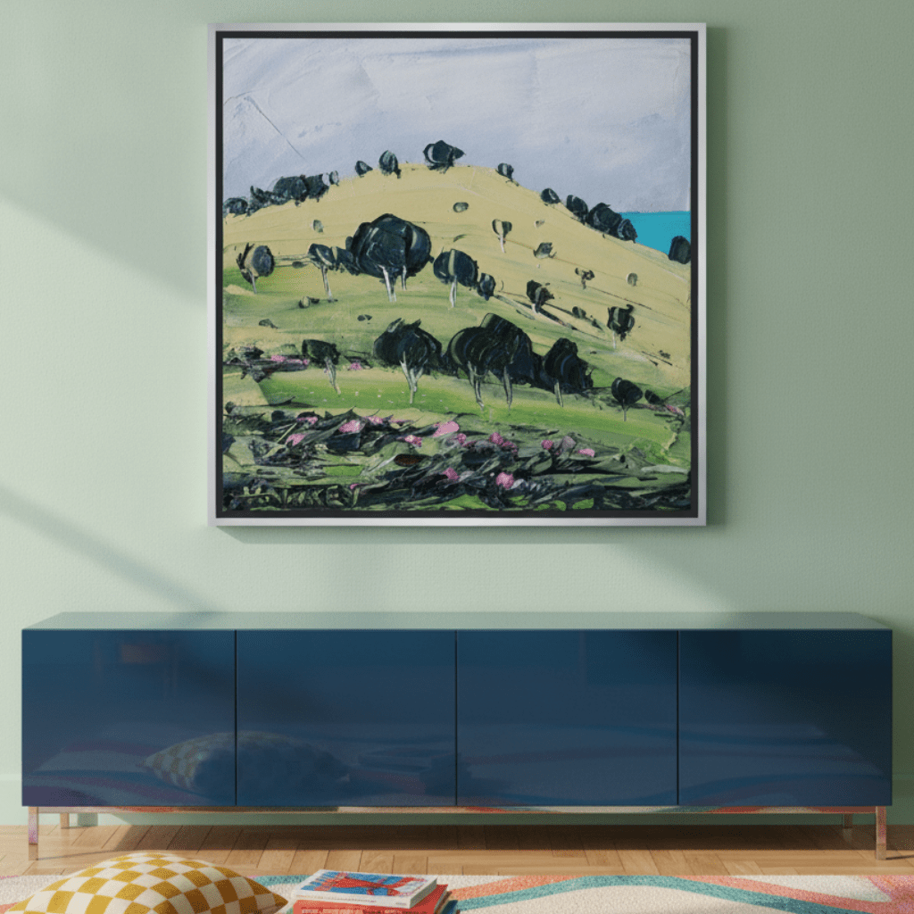 Canvas wall art with a silver leaf surround styled on the wall in a colourful eclectic living room