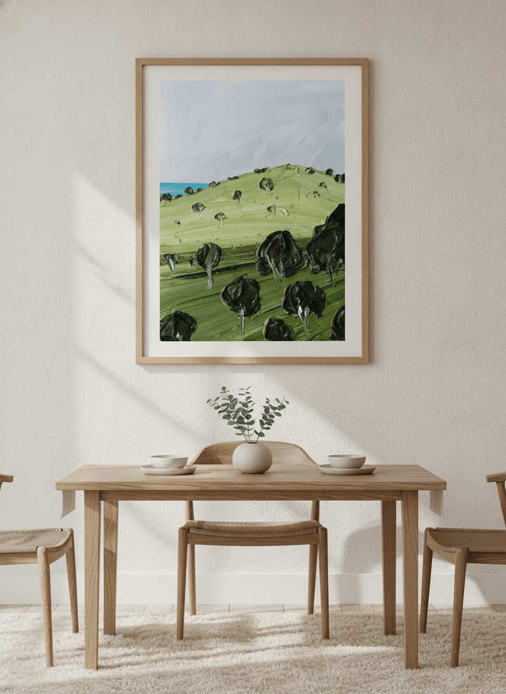 Wall art styled above a dining table in a contemporary home