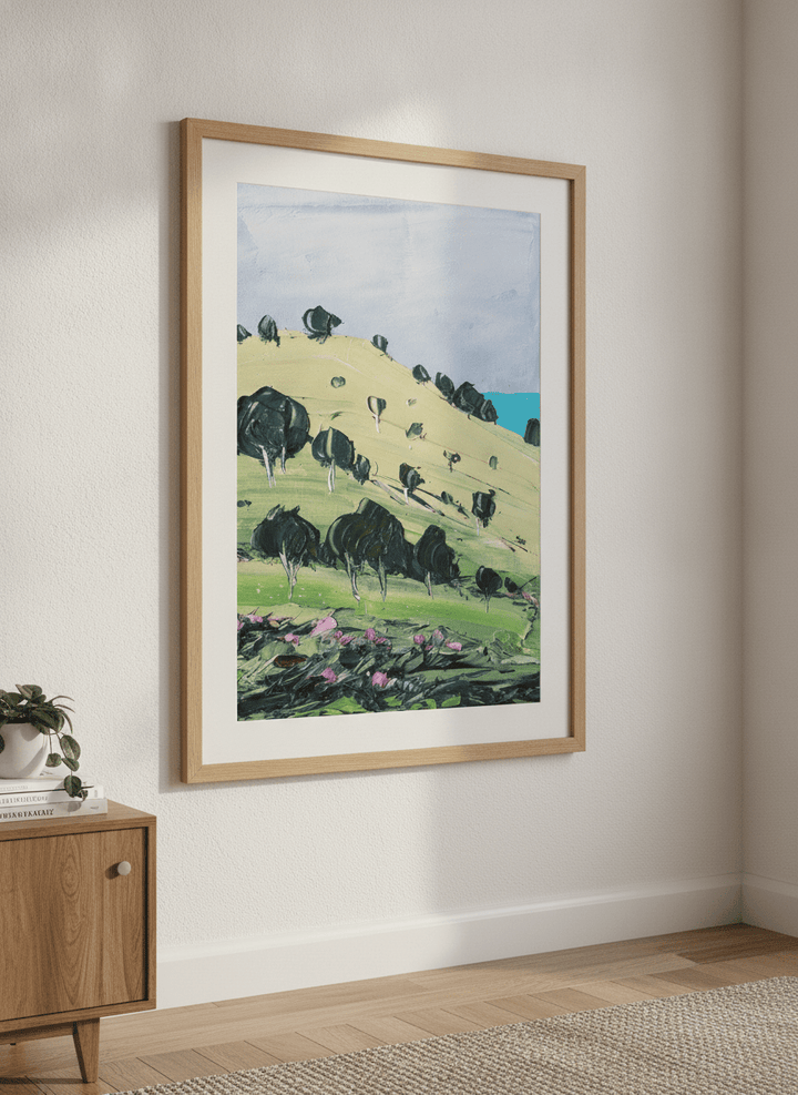 Modern wall art styled above a sofa in a neutral living room