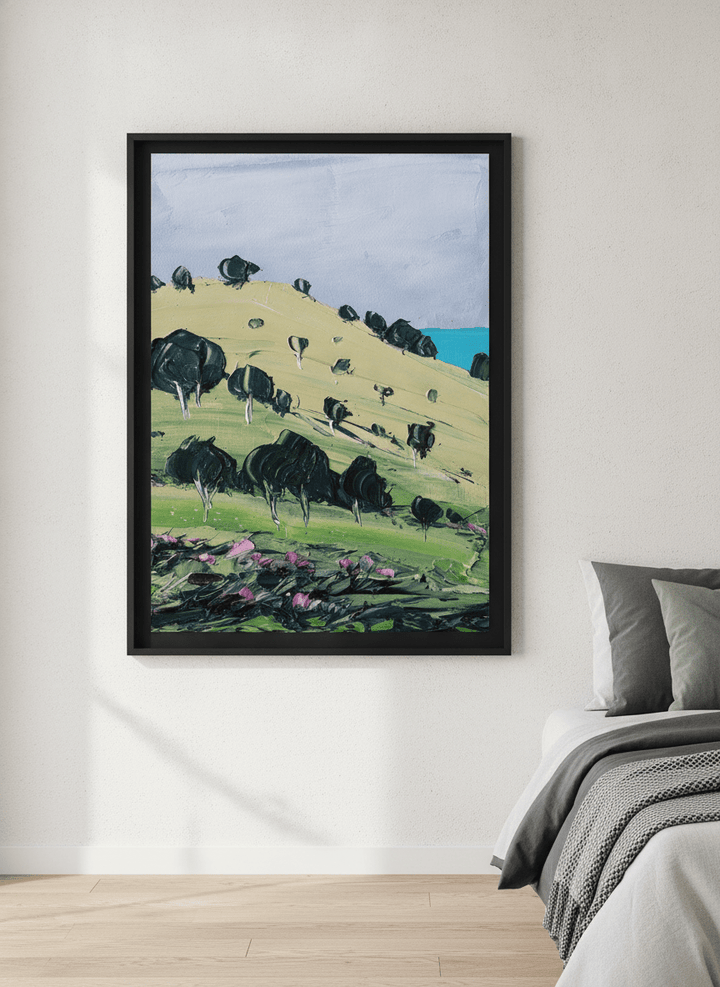 Minimalist artwork displayed in a calm, light-filled bedroom interior