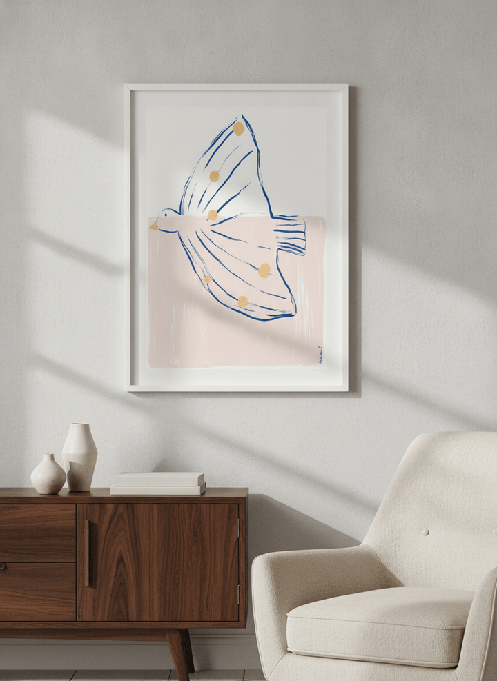 Modern wall art styled above a sofa in a neutral living room