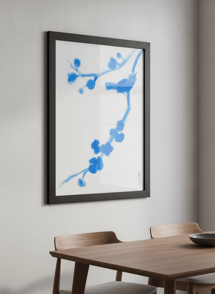Wall art styled above a dining table in a contemporary home