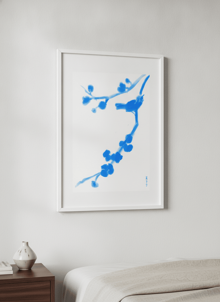 Minimalist artwork displayed in a calm, light-filled bedroom interior