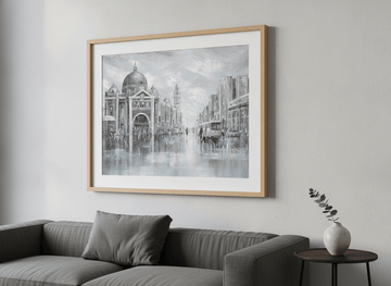 Modern wall art styled above a sofa in a neutral living room