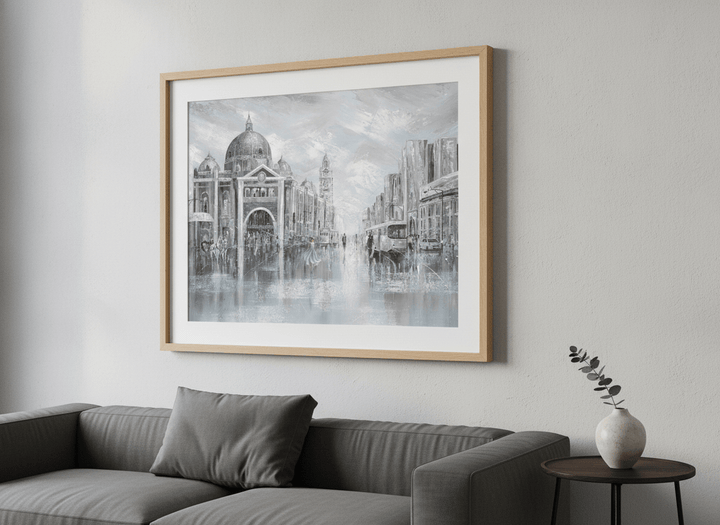 Modern wall art styled above a sofa in a neutral living room