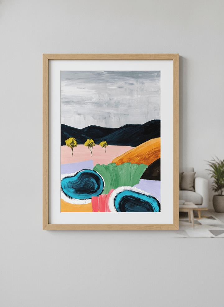 Modern wall art styled above a sofa in a neutral living room