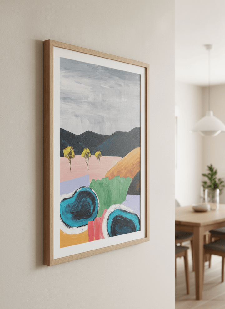 Wall art styled above a dining table in a contemporary home