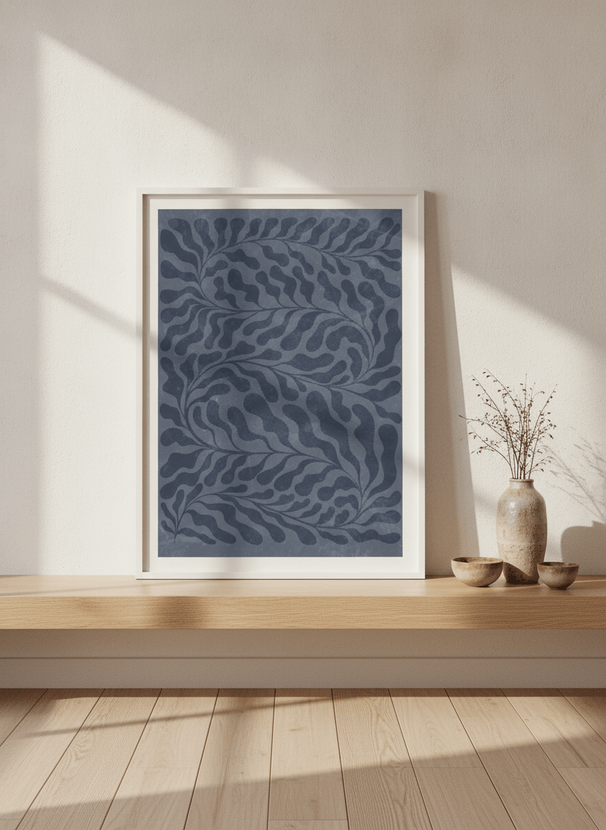 Modern wall art print standing on a shelf in a warm Japandi home office
